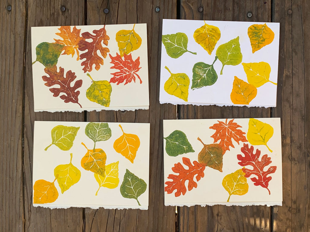 linocut notecards of fall leaves in autumn colors printed randomly