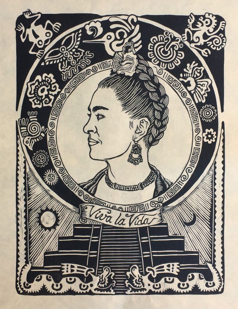 woodcut of profile of frida kahlo with mexican symbols border