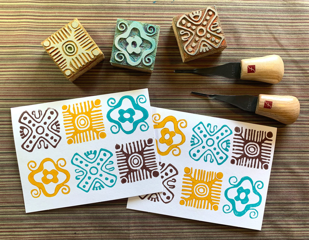 linocut notecards of geometric designs in brown gold turquoise