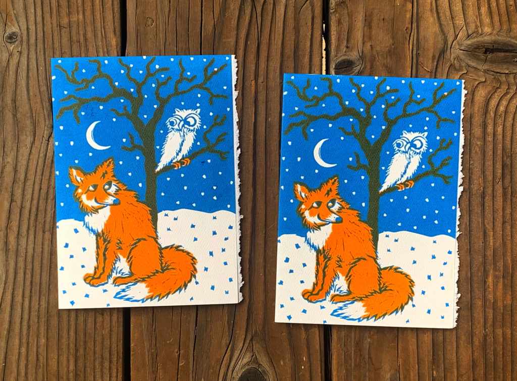 linocut notecard of orange fox and white owl in winter bare tree looking at each other