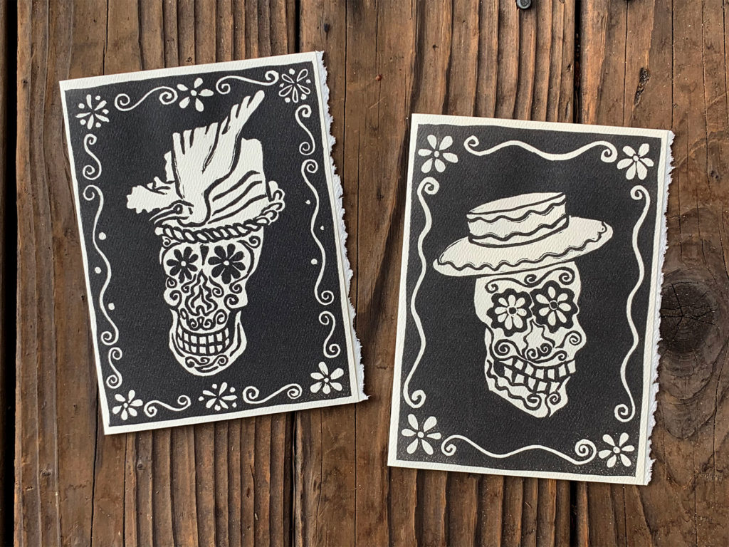 linocut notecard of sugar skulls day of the dead skulls have fancy hats