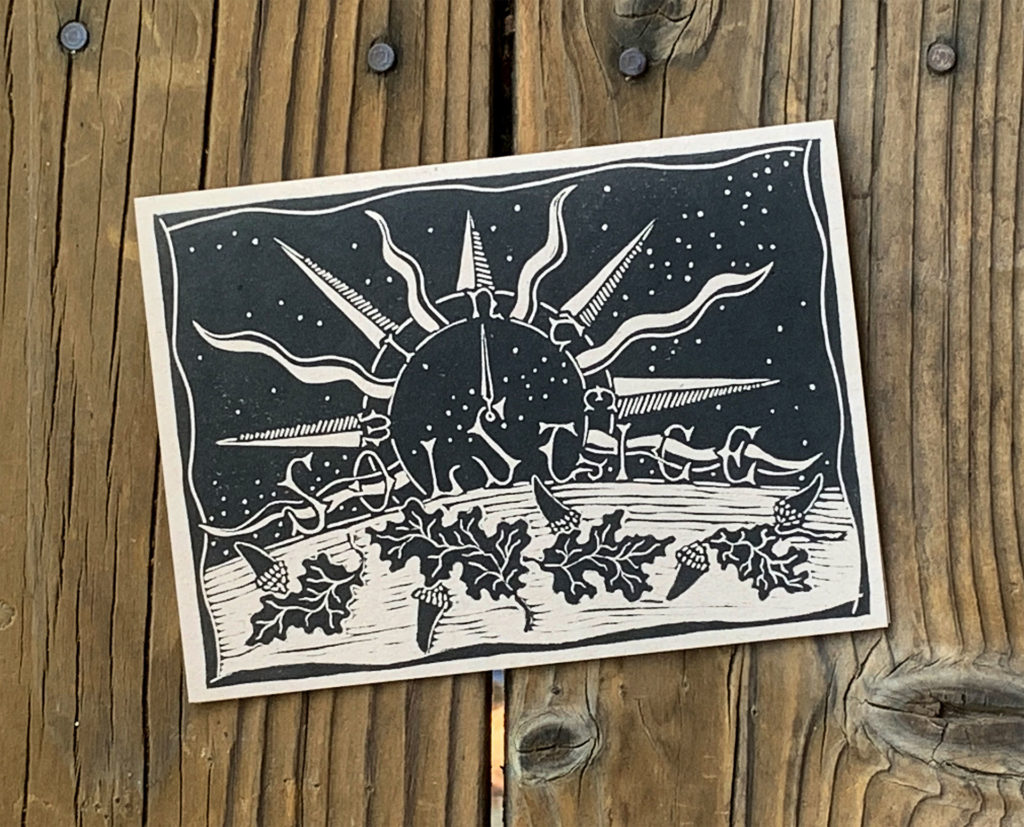 linocut note card of night sky with stars compass sun rays oak leaves acorns in black