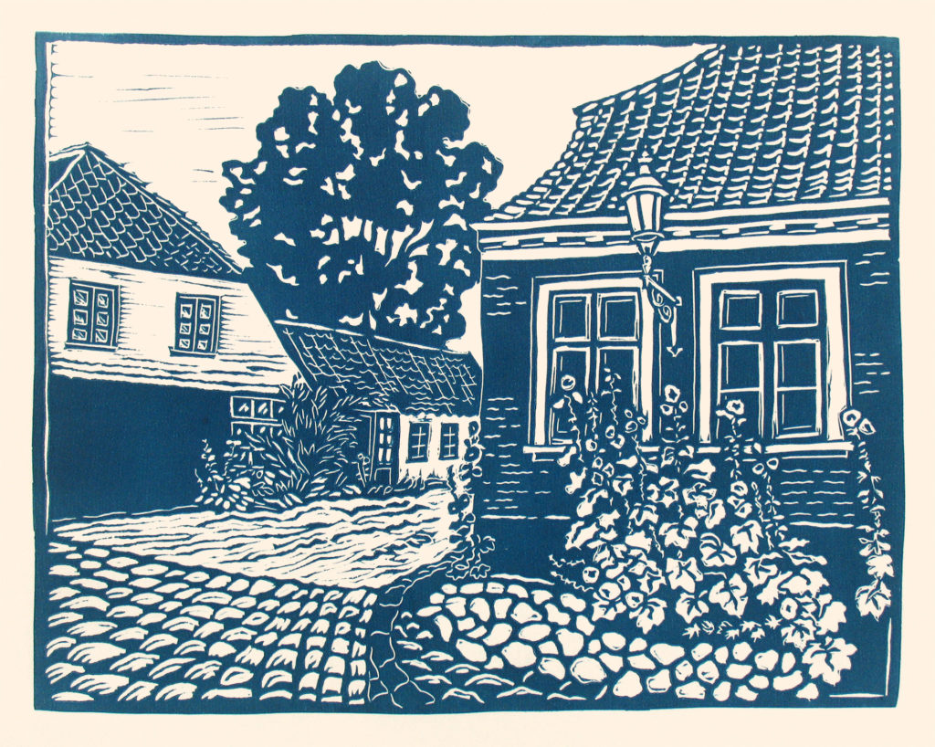 linocut of quaint houses with cobblestone dirt road in aeroskobing denmark